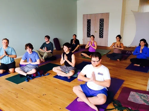 Group yoga and meditation session in a studio